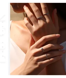 Elegant macro view of vintage S925 silver wheat ear stacking rings on female hand