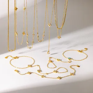 Detailed macro view of an elegant gold-plated clover jewelry set with colorful crystals