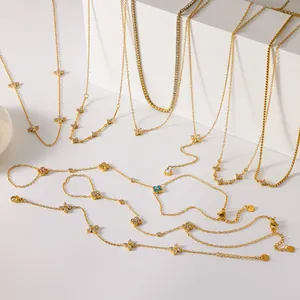 Detailed view of golden clover jewelry set featuring colorful sparkling rhinestones.