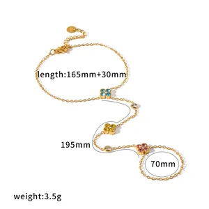 Detailed view of a golden stainless steel finger chain with colorful clover measurements.