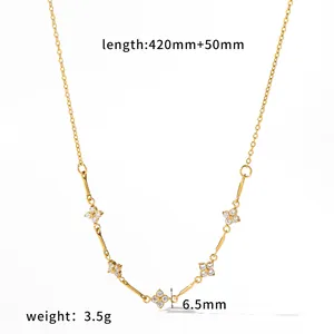 Detail view of a gold stainless steel clover necklace with crystal measurements.