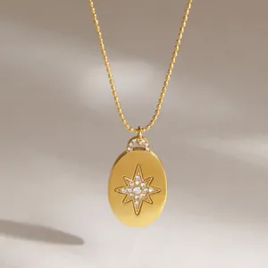 Detail shot of a gold stainless steel necklace with rhinestone North Star pendant