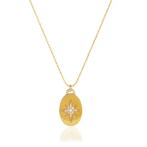 Elegant gold plated starburst pendant necklace with sparkling rhinestones on a ball chain