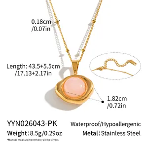 Detailed view of gold stainless steel necklace with pink stone and dimensions.