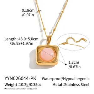 Detailed view of a gold stainless steel necklace with a square pink quartz pendant.