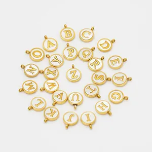 Set of 26 gold stainless steel alphabet round charms with white enamel background