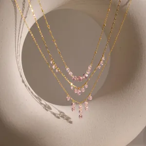 Elegant 18K gold plated stainless steel necklace with pink zirconia tassel pendants