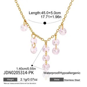 Detailed view of 18K gold plated stainless steel necklace with pink zirconia tassels