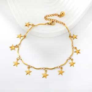 Detailed view of a gold-plated stainless steel anklet with elegant hanging star charms