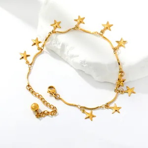 Detailed view of a gold stainless steel anklet with star charms on a elegant white background