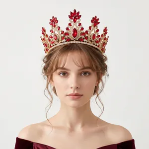 Close-up of ornate baroque bridal crown with red rhinestones and gold alloy for weddings