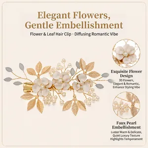Detailed close-up showing white flowers, pearls, and golden leaves of a handmade hair clip
