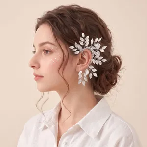 Detail of a vintage silver crystal leaf elf ear cuff worn on a non-pierced ear.