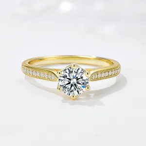 Detail of elegant gold-plated S925 silver ring with classic six-prong diamond setting.