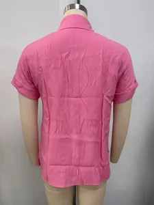 Back view of a pink linen short sleeve shirt for women with casual loose fit style