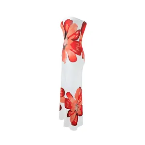 Detailed side view of a white strapless maxi dress featuring vibrant red floral prints.