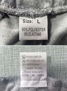 Close-up of men's joggers care label showing 95% polyester fabric and size L