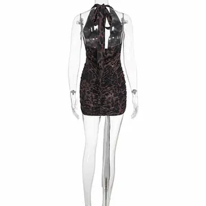Detailed back view of a leopard print halter neck backless slim fit mini dress.