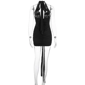 Detail back view of a sexy black halter backless ruched mini dress with a long sash.
