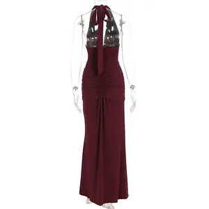 Back view of elegant burgundy halter maxi dress showing ruched details and tie-neck design