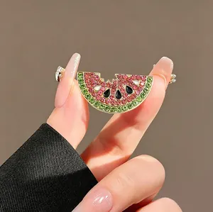 Cute watermelon slice brooch with pink and green rhinestones and bite detail detail view