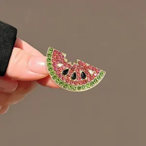Cute watermelon rhinestone brooch pin with pink and green crystals for clothing decoration.