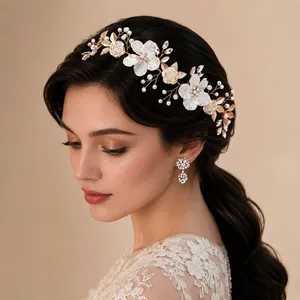 Close-up of handmade pearl flower bridal hair accessory with matching earrings