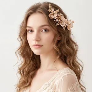 Detailed view of elegant bridal hair comb with clay flowers and crystal leaves on a model