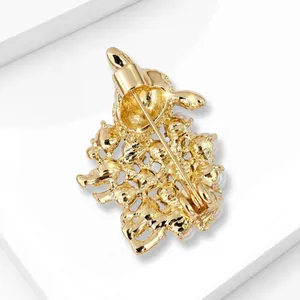 Detailed back view of gold lamb brooch with secure pin clasp and intricate metalwork