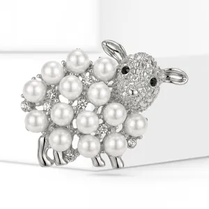 Detailed view of a cute sheep brooch featuring white pearls and silver-toned metal.
