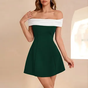 Elegant off-the-shoulder color-block mini dress in dark green and white for formal events.