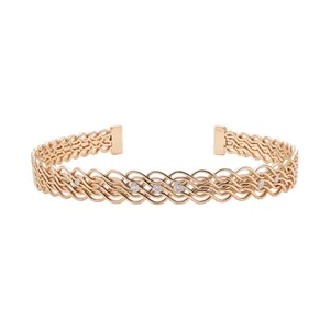 Elegante bracciale rigido intrecciato in oro rosa con pietre di zircone bianco incastonate