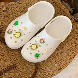 Detailed view of tropical fruit and palm tree charms for DIY clog shoe decoration