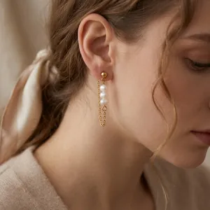 Elegant 18K gold plated stainless steel earrings with freshwater pearls and tassels