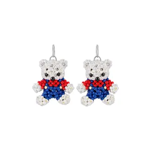 Cute handcrafted beaded teddy bear earrings in white red and blue colors for women
