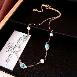 Elegant gold-plated necklace with freshwater pearls and turquoise teardrop pendants