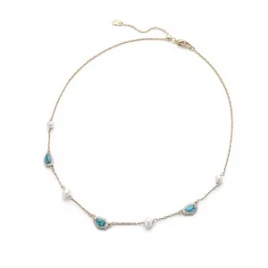Elegant gold plated necklace featuring freshwater pearls and blue turquoise teardrop pendants