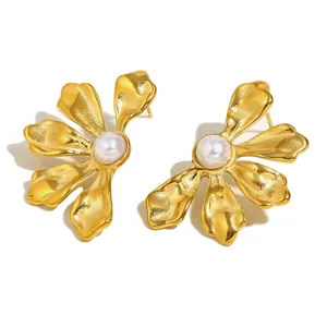 Elegant 18K gold plated stainless steel flower earrings with pearls on a white background