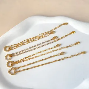 Set of five elegant gold stainless steel bracelets with heart charm and tennis chain