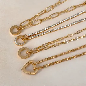 Detail of gold plated stainless steel chains including paperclip and heart clasps
