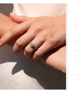 Detail shot of S925 silver moissanite ring on hand with elegant 1ct sparkling stone