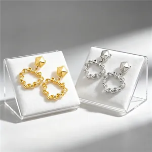 Vintage geometric stainless steel earrings with wavy hollow texture in gold and silver