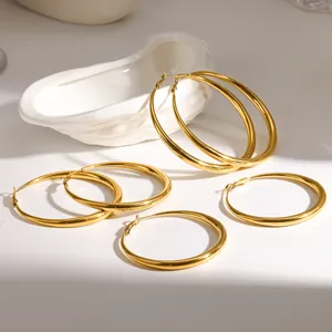 Detailed view of polished 18K gold plated stainless steel hoop earrings in various sizes