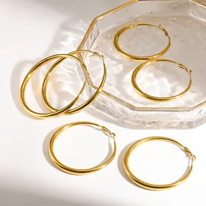 Detailed view of shiny 18K gold plated stainless steel hoop earrings in various sizes