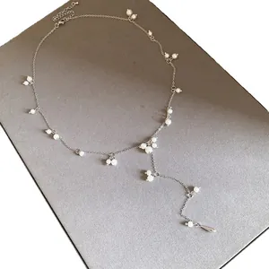 Elegant French-style silver necklace featuring delicate pearls and a Y-shaped pendant