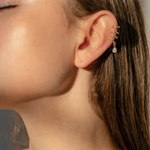 Gold stainless steel multi-layer ear cuff with waterdrop zircon on model