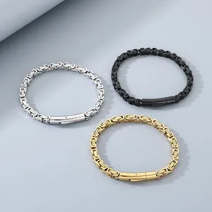 Trio of unisex stainless steel Byzantine chain bracelets in silver, black, and gold finish.