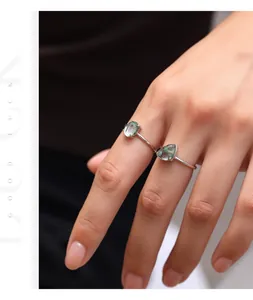 Detailed view of an elegant S925 sterling silver ring with synthetic green moss agate