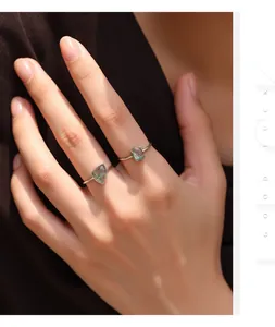 Retro S925 sterling silver rings with irregular moss agate stones on female hand