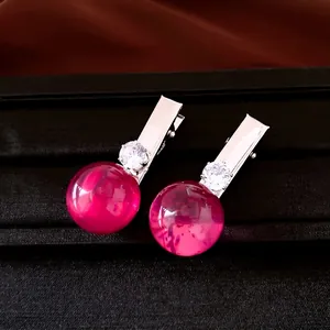 Elegante Vintage-Haarspangen aus rosa Harz mit funkelnden Kristallakzenten